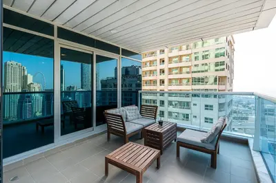 a balcony with a view of a city skyline at Modern 2 Bed with Waterfront Views, Gym & Pool in Dubai