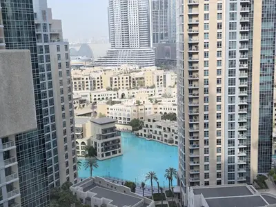 arial view of a city with a pool in the middle of buildings at Boulevard Charm- Studio Hideaway in Dubai