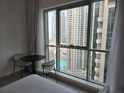 a hotel room with a view of the city from a window at Boulevard Charm- Studio Hideaway in Dubai
