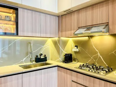 a kitchen with a sink and a stove top oven at 1BDR with Gym, Sauna, Pool - Opposite Circle Mall in Dubai
