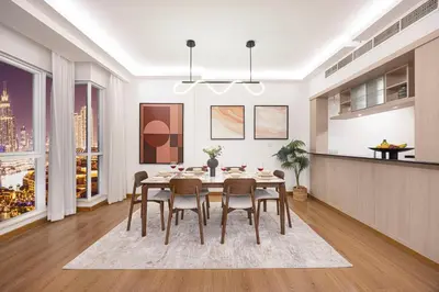 a kitchen and dining room with a table and chairs at Panoramic Fountain & Burj Khalifa Views, Pool, Gym in Dubai