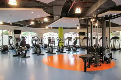 a gym with a bunch of exercise bikes in it at Private Room Steps from Jumeriah Beach & Marina Walk - LMY Sadaf 7 JBR Dubai in Dubai