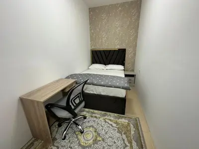 a small room with two beds and a chair at Private Room Steps from Jumeriah Beach & Marina Walk - LMY Sadaf 7 JBR Dubai in Dubai