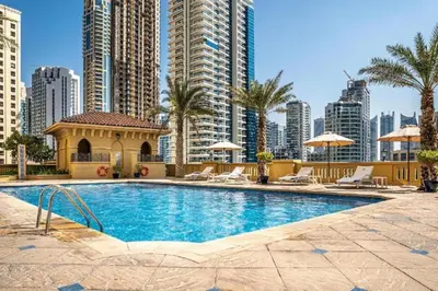 a swimming pool in a city with tall buildings at Private Room Steps from Jumeriah Beach & Marina Walk - LMY Sadaf 7 JBR Dubai in Dubai