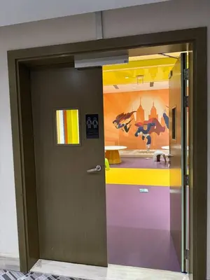 a door in a room with a painting on the wall at Studio With Canal View in Dubai