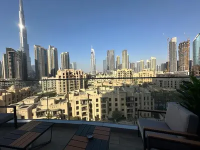 a view of a city skyline from a balcony at IMPERIAL AVENUE Brand New Ultra Luxury Full Downtown, Old Town & Burj Khalifa Amazing View! Unforgettable Stay! in Dubai