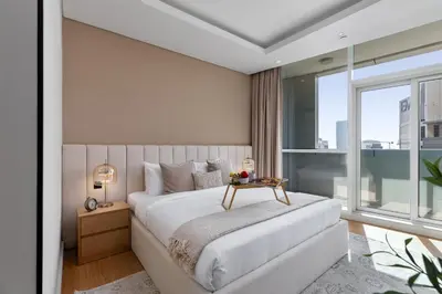 a bedroom with a bed and a large window at Maison Privee - Dazzling Downtown Retreat with Panoramic City Views in Dubai