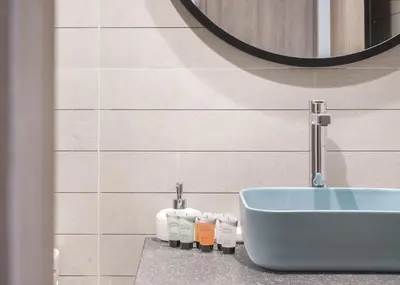 a bathroom with a sink and a blue tub at Brand New Studio for 4 Guests - Near Dubai Mall in Dubai