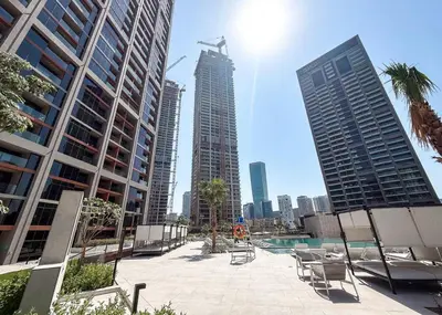 a view of a city with a pool and buildings at Brand New Studio for 4 Guests - Near Dubai Mall in Dubai