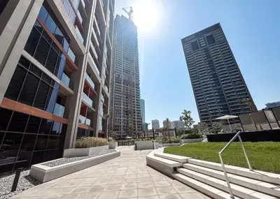 a building with two tall buildings in a city at Brand New Studio for 4 Guests - Near Dubai Mall in Dubai