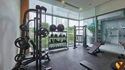 a gym with several tread machines in a room at Vogue Downtown Vida Dubai Mall, Direct Access to Dubai Mall via Climate Controlled bridge, Two Bedroom Apartment with Full Burj Khalifa View from Balcony and Access to all Amenities in Dubai