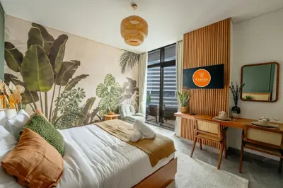a bedroom with a bed and a desk and a computer at EasyGo - Bright Studios in The Heart of Business Bay in Dubai