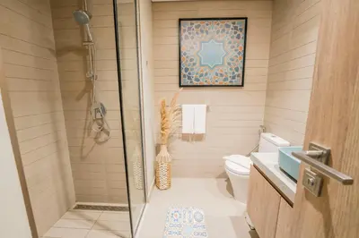 a bathroom with a shower and a toilet at EasyGo - Bright Studios in The Heart of Business Bay in Dubai