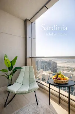 a room with a table and a chair and a bowl of fruit at Studio for 4 just 5 Min Walk to Burj Khalifa, Downtown Dubai, Tower Elite 1 in Dubai