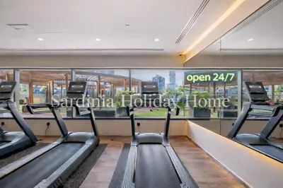 a gym with treadmills in a building at Studio for 4 just 5 Min Walk to Burj Khalifa, Downtown Dubai, Tower Elite 1 in Dubai