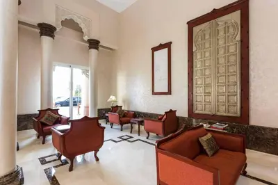 a lobby with couches and chairs and a mirror at Elegant 2BR Beach Apartment Grandeur Residence, Palm Jumeirah in Dubai