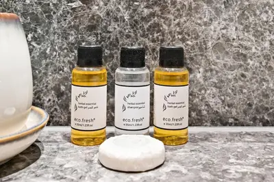three bottles of essential oils sitting on a counter at 28th Floor Apartment Next to Burj And Mall Sleeps 7 in Dubai