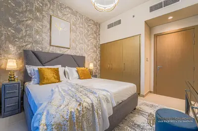 a bedroom with a king sized bed in a room at Modern 1BR Apartment in Dubai Creek Harbour by DVR Vacation Homes in Dubai