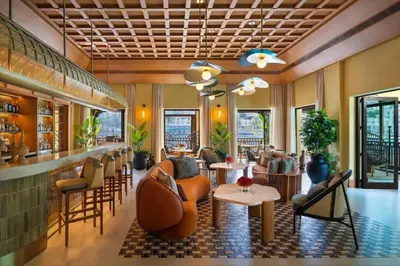 a lobby of a restaurant with chairs and tables at Luxury 2BR at Address Opera with Burj Khalifa View in Dubai