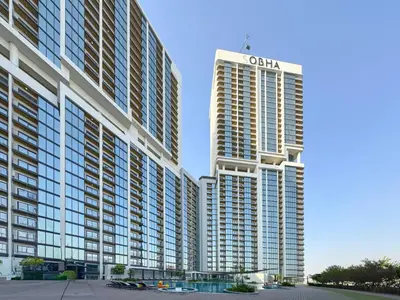 a tall building with a sign on top of it at Trophy - Modern 2BR in Crest Tower in Dubai