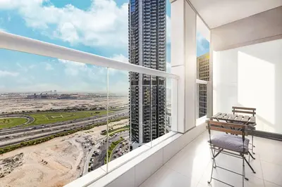 an apartment balcony with a view of a city at Paramount Luxe Suite, Business Bay in Dubai
