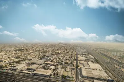 an aerial view of a large city with buildings at Skyline Retreat, 2BDR Ensuite Comfort, City View in Dubai