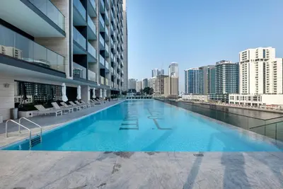 a swimming pool in the middle of a building at Modern Luxe | Heart of Dubai | Trillionaire Living in Dubai