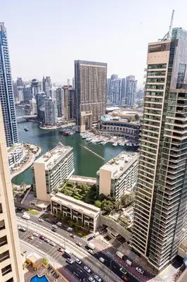 an aerial view of a city with a river and buildings at Stylish 2-Bedroom Apartment with Marina View JBR in Dubai