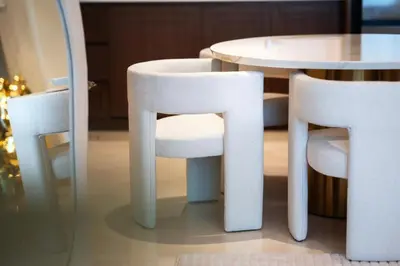 two white chairs and a table in a room at Palace Beachfront Dubai Harbour in Dubai