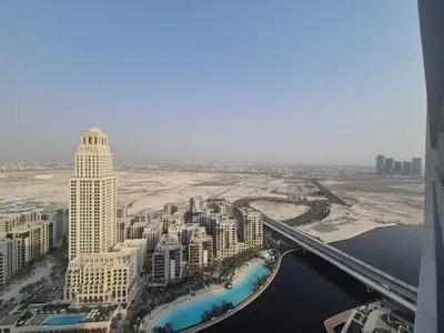 an aerial view of a city with a bridge at Luxury two beds apartment in Dubai