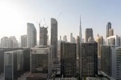 a view of a large city with tall buildings at Dubai Luxury 2BR - Pool, Gym & Burj Khalifa View in Dubai