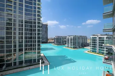 a view of a pool in a city with tall buildings at LUX The Burj Khalifa Lagoon View Suite 4 in Dubai
