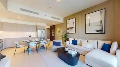 a living room with a couch and a table at Vacationer l Fountain, Burj Khalifa View l 2 Bedroom l Downtown Dubai in Dubai