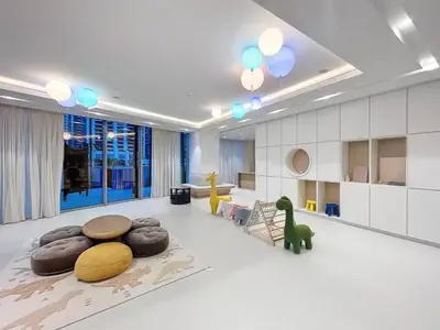 a living room with a dinosaur on the floor at Vacationer l Fountain, Burj Khalifa View l 2 Bedroom l Downtown Dubai in Dubai