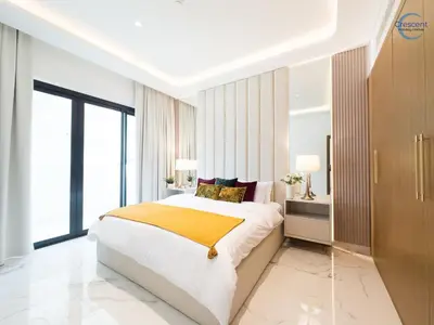 a bedroom with a large bed and a large window at Modern Retreat at Azizi Azure, Meydan in Dubai