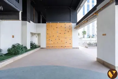 a large room with a wooden door in a building at Vogue JVC Jeewar Tower near Circle Mall, Two Bedroom Apartment with Balcony and City View, Access to all Amenities in Dubai