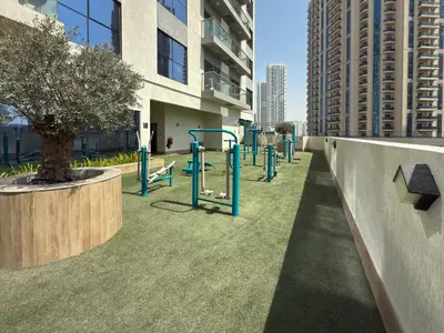 a park with a playground in a building at Vogue JVC Jeewar Tower near Circle Mall, Two Bedroom Apartment with Balcony and City View, Access to all Amenities in Dubai