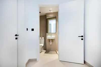 a bathroom with a toilet and a sink at Opera Grand Sky Luxurious 3-Bedroom Apartment in Downtown Dubai with Panoramic Burj Khalifa View in Dubai