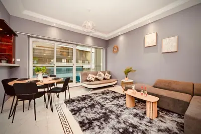 a living room with a couch and a table at Luxury Retreat Your High Floor Heaven in Marina in Dubai