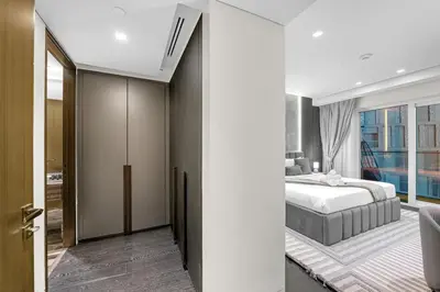 a bedroom with a bed and a large window at Lavish Marina Gem - Dubai Eye Views - Infinity Pool in Dubai