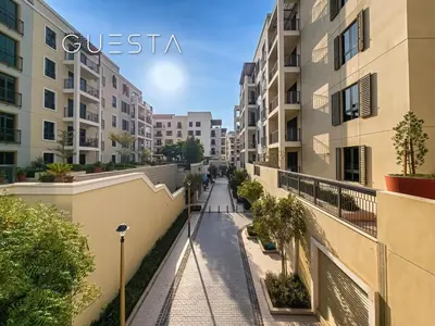 a street in a city with apartment buildings at La Cote by Merass, La Mer Dubai in Dubai