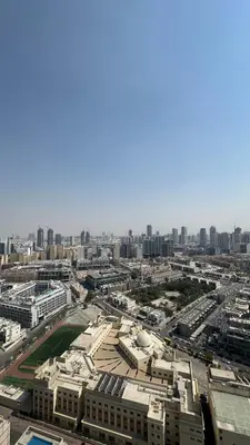 an aerial view of a large city with buildings at Modern & Fully Furnished 1BR in Heart of JVC in Dubai