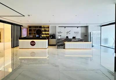 a lobby with a reception desk in a building at Signature Vista Studio Apartment in Dubai