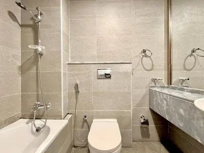 a bathroom with a toilet and a sink at Signature Vista Studio Apartment in Dubai