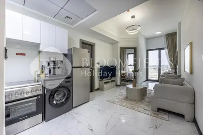 a living room with a washer and dryer at Bloomfields Cozy 1br In Rukan in Dubai