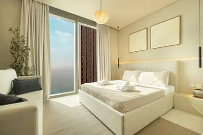 a bedroom with a large bed and a large window at Premium Corner 3BR, Sea Views with Sunset, 85 inch TV in Dubai