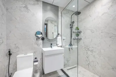 a bathroom with a toilet and a sink and a shower at Bright studio oplaz by Danube Near Miracle Garden in Dubai