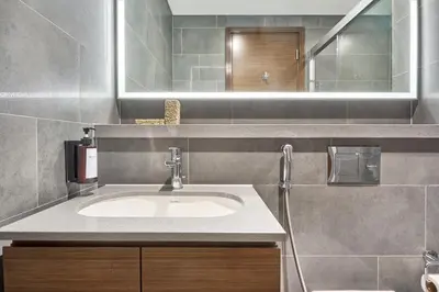 a bathroom with a sink and a mirror at STAY BY LATINEM Luxury 2BR Holiday Home CB 1215 Near Burj Khalifa in Dubai