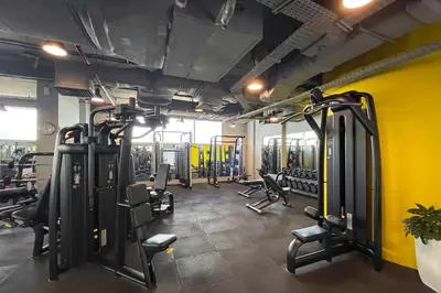 a gym with lots of treadmills and chairs in it at Silkhaus Gallery Studio at Sky Gardens in DIFC in Dubai