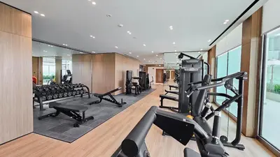 a gym with treadmills and cardio equipment in a building at StayShort - Perfect Studio in Binghatti Azure JVC - Sleeps 2 in Dubai